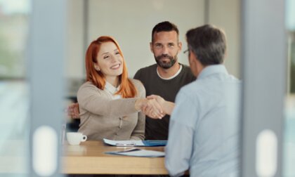 People shake hands on a business deal