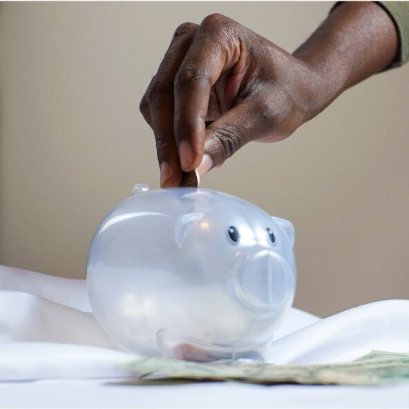 Putting money in the piggy bank